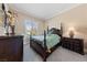 Bedroom featuring carpeted floors, a ceiling fan, and a window with natural light at 3016 High Range Dr, Las Vegas, NV 89134