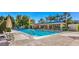 Resort-style community pool with comfortable seating, umbrellas, and a covered pavilion for relaxation and socializing at 3016 High Range Dr, Las Vegas, NV 89134
