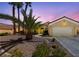 Charming single Gathering home with a two car garage, desert landscaping and swaying palm trees at 3016 High Range Dr, Las Vegas, NV 89134