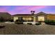 Well-maintained single-story home with desert landscaping, a cozy outdoor seating area, and a tranquil setting at 3016 High Range Dr, Las Vegas, NV 89134