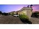 Inviting single-story home featuring desert landscaping and a cozy outdoor seating area at 3016 High Range Dr, Las Vegas, NV 89134
