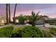 Inviting single-story home showcases desert landscaping, palm trees, and a well-manicured front yard at 3016 High Range Dr, Las Vegas, NV 89134
