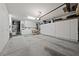 A well-organized garage featuring white cabinets, a workbench, and storage solutions for optimal space and functionality at 3016 High Range Dr, Las Vegas, NV 89134