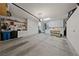 Spacious garage featuring built-in cabinets and ample storage, with a workbench and plenty of open floor space at 3016 High Range Dr, Las Vegas, NV 89134