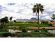 A picturesque view of the golf course with a water feature and mountain backdrop at 3016 High Range Dr, Las Vegas, NV 89134