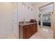 Hallway featuring tiled floor and cabinetry, leading into the bedroom at 3016 High Range Dr, Las Vegas, NV 89134