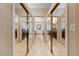 This hallway features double closets and tiled floors at 3016 High Range Dr, Las Vegas, NV 89134