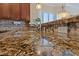 Close-up of a granite kitchen countertop with a sink, faucet, and decorative backsplash at 3016 High Range Dr, Las Vegas, NV 89134