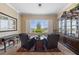 Cozy sitting area with plush chairs, a view through the window, and built-in cabinetry at 3016 High Range Dr, Las Vegas, NV 89134