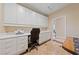 Functional office space features built-in cabinetry, a desk area, and tiled flooring at 3016 High Range Dr, Las Vegas, NV 89134