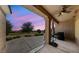 Relaxing covered patio with golf course views and ceiling fan for outdoor comfort at 3016 High Range Dr, Las Vegas, NV 89134