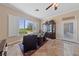 Comfortable sitting area with a view, elegant furnishings, and a decorative cabinet at 3016 High Range Dr, Las Vegas, NV 89134