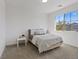 Bright, cozy bedroom with a full size bed, neutral decor, and large windows offering plenty of natural light at 3038 Villanelle Ave, Henderson, NV 89044