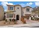 Charming two-story home featuring a welcoming entrance, two-car garage, and landscaped front yard at 3038 Villanelle Ave, Henderson, NV 89044