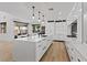 Bright kitchen with an oversized island, modern cabinetry, and an adjacent dining area at 3038 Villanelle Ave, Henderson, NV 89044