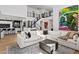 Bright, open living room with modern decor and staircase leading to the second floor at 3038 Villanelle Ave, Henderson, NV 89044