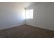 Bright and cozy bedroom featuring new carpet and a window at 3115 Wright Ave, North Las Vegas, NV 89030
