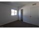 This bedroom features carpet floors, a window, and a sliding closet at 3115 Wright Ave, North Las Vegas, NV 89030