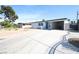 Charming single-story home featuring a covered carport and a spacious driveway at 3115 Wright Ave, North Las Vegas, NV 89030