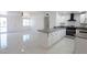 Modern kitchen featuring white cabinets, stainless steel appliances, and an island at 3115 Wright Ave, North Las Vegas, NV 89030