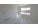 This room has sleek marble-look floors and a bright window at 3115 Wright Ave, North Las Vegas, NV 89030