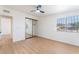 Bedroom with mirrored closet doors and light wood flooring, offering ample space and natural light at 3320 Osage Ave, Las Vegas, NV 89101