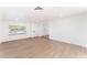 Well-lit living area with fresh paint, wood flooring, and modern recessed lighting at 3320 Osage Ave, Las Vegas, NV 89101