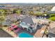 A backyard including a basketball court, inground pool, and covered patio area at 3382 Montessouri, Las Vegas, NV 89117