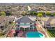 Expansive aerial view of backyard with pool and basketball court in a residential neighborhood at 3382 Montessouri, Las Vegas, NV 89117