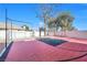 A beautiful fenced in backyard basketball court at 3382 Montessouri, Las Vegas, NV 89117