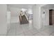Open foyer featuring tile flooring, stairs to the upper level, and a view to the living spaces at 3382 Montessouri, Las Vegas, NV 89117
