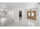Spacious tiled foyer featuring double doors, a ceiling fan, and a glimpse of the kitchen at 3382 Montessouri, Las Vegas, NV 89117