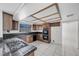 Spacious kitchen features dark wood cabinets, tiled countertops, and stainless steel appliances at 3382 Montessouri, Las Vegas, NV 89117