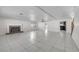 Expansive living room with tile flooring, a fireplace, and ample natural light at 3382 Montessouri, Las Vegas, NV 89117