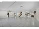 Spacious living area with tile flooring, access to various rooms, and a bright, open layout at 3382 Montessouri, Las Vegas, NV 89117