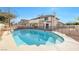 A stunning inground pool with concrete surround in a beautiful backyard setting at 3382 Montessouri, Las Vegas, NV 89117