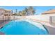 A beautiful backyard pool surrounded by mature desert landscaping at 3382 Montessouri, Las Vegas, NV 89117