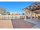 Backyard featuring a sparkling pool, rock landscaping, and covered patio at 3382 Montessouri, Las Vegas, NV 89117