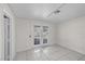 Bright room with white tile and double glass doors leading outside at 3382 Montessouri, Las Vegas, NV 89117
