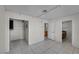 Room with white tiled floors and access to a small storage area and another room at 3382 Montessouri, Las Vegas, NV 89117