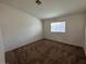 Bedroom with carpet flooring and natural light from large window at 3429 Back Country Dr, North Las Vegas, NV 89031