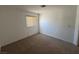 This carpeted bedroom features a window and neutral walls, ready for your personal touch at 3429 Back Country Dr, North Las Vegas, NV 89031