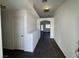 Inviting entryway with dark wood-look floors and freshly painted white walls at 3429 Back Country Dr, North Las Vegas, NV 89031