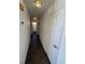 Hallway leads past bathroom to a bedroom and features sleek hard surface flooring at 3429 Back Country Dr, North Las Vegas, NV 89031