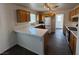 Functional kitchen with light countertops, wooden cabinets and durable floors, perfect for cooking and entertaining at 3429 Back Country Dr, North Las Vegas, NV 89031