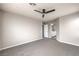 Spacious bedroom features neutral carpeting, ceiling fan, and an ensuite bathroom at 3731 Prairie Orchid Ave, North Las Vegas, NV 89081