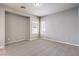 Spacious bedroom with neutral carpet, light gray walls, two windows letting in natural light at 3731 Prairie Orchid Ave, North Las Vegas, NV 89081