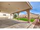 Spacious covered patio with views of the backyard, lawn, and fountain at 3731 Prairie Orchid Ave, North Las Vegas, NV 89081