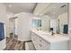 Bright bathroom with dual sinks, vanity and large mirror at 3749 Climbing Rose St, Las Vegas, NV 89147