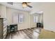 Inviting bedroom with a closet, window with blinds and wood-look floors at 3749 Climbing Rose St, Las Vegas, NV 89147